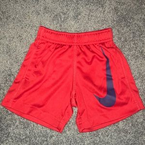 Red Nike shorts • size 2t